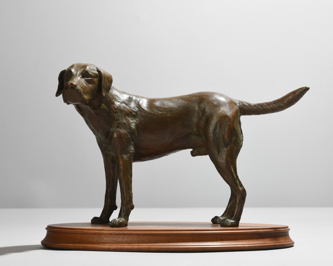 Andre Harvey (1941-2018) Bronze Labrador: Signed, dated 1974, and numbered 24/60. On oval wooden base. Minor wear to base. Dimensions approx. 8 1/2" x 12" x 6 1/2". VHC 302 Our primary recommendation is to arrange shipping yourself using Blue