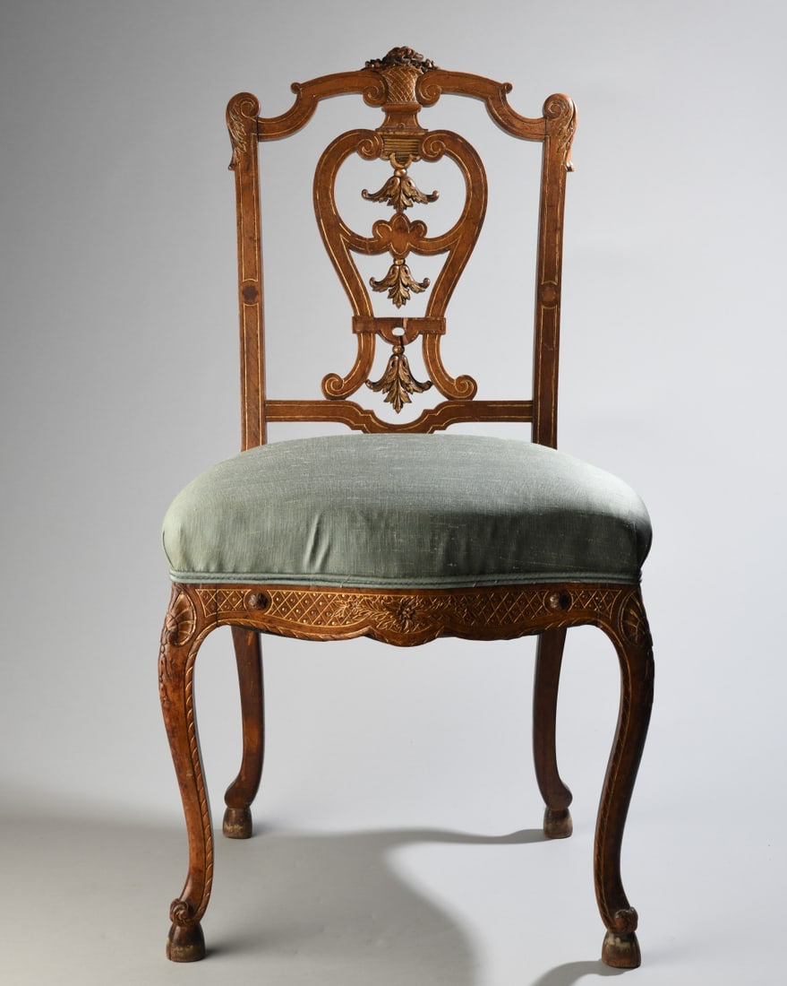 Edwardian Carved and Gilt Decorated Side Chair: Edwardian mahogany side chair, featuring a richly carved and pierced splat back with floral crest, gilt-incised decoration, and cabriole legs. Dimensions approx. 33 3/4" x 18" x 16". Our primary recom