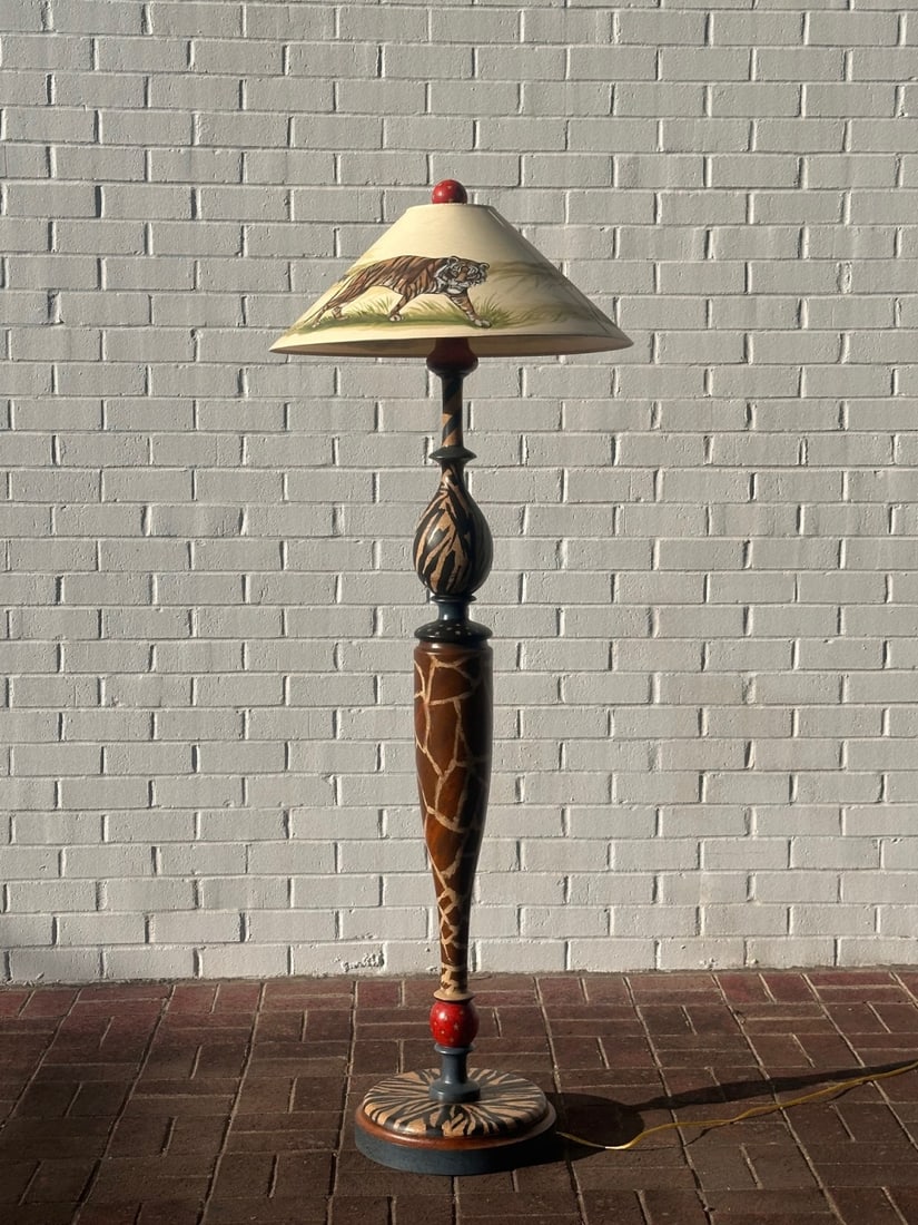 Marlene Coble Painted Safari Theme Lamp: Whimsical painted floor lamp with hand painted shade, signed “Marlene Coble 2008” on the shade. Powers on.H: approx. 67", shade dia: approx. 25". Our primary recommendation is to arrange shipp