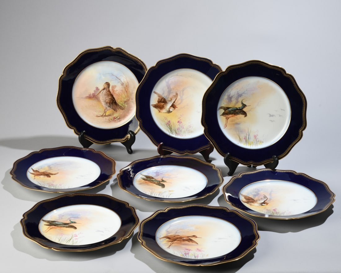 Set of 8 Limoges Hand-Painted Bird Plates: Eight porcelain plates with cobalt blue and gilt borders, each hand-painted with a unique bird. Seven signed to front Julien and one signed to front L Raby, all with Wm. Guerin & Co and Limoges marks