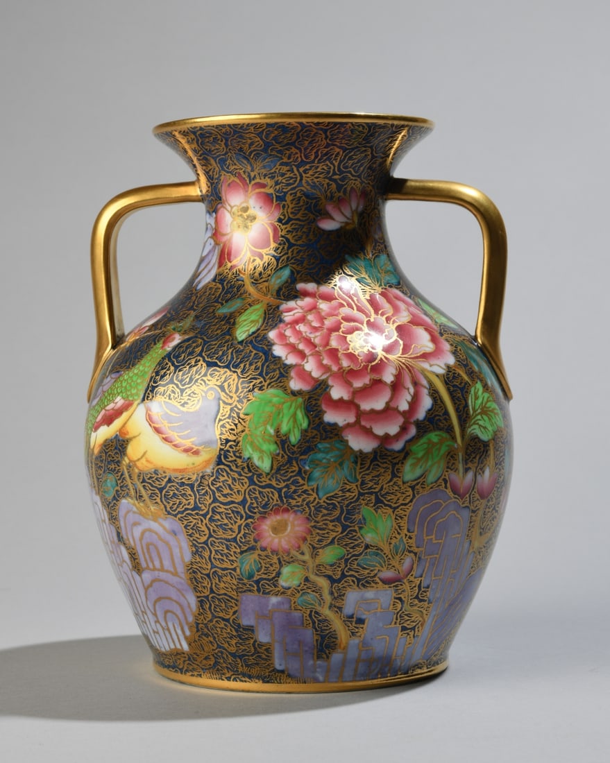 Copelands Spode Hand-Painted Vase: Porcelain vase hand-painted with Asian floral and bird motifs, gilt handles, marked to underside Spode Copelands China England. Dimensions approx. 6 3/4" H x 5 3/4" dia. Our primary recommendation is 