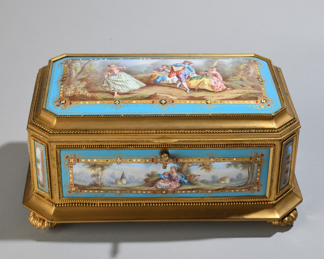 French 19th C. Gilt Bronze & Enamel Jewelry Casket: French, third quarter 19th century. Gilt bronze mounted jewelry casket of chamfered rectangular form, the hinged lid and sides inset with hand painted enamel plaques depicting romantic pastoral and f�