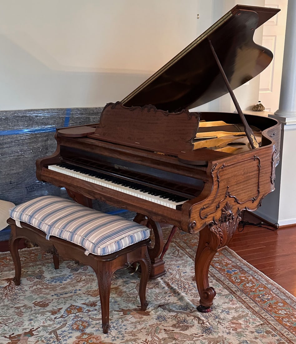 Kranich & Bach Carved Grand Piano: Serial number 57654, with maker’s name on fallboard and cast iron plate, the plate also marked “Tonic Pedal Action — Spiral Spring.” Serial number appears to fall between published 1910 an