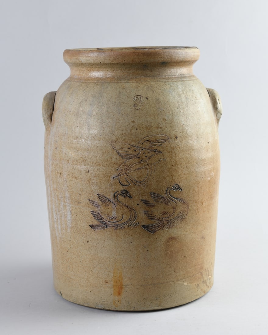 19th C. Stoneware Crock: Body incised with an eagle in flight above two swans, impressed capacity mark "3". Likely second half 19th century. Hairline to top. H: approx. 13 1/2". Dia: approx. 9 1/2". Our primary