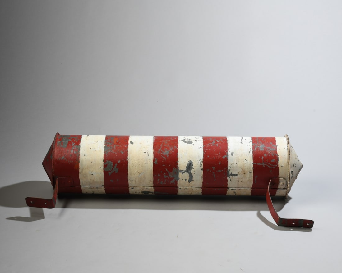 Antique Painted Barber Pole: Painted metal barber pole or barber pole trade sign section, with cylindrical body decorated in red and white bands, faceted conical cap ends, and bent metal mounting brackets. Circa early 20th