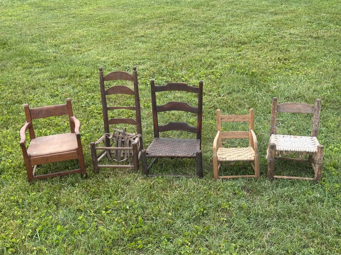 Group of Five Antique Children's Chairs: 19th / 20th century, including armchairs and ladder-back examples with woven splint, rush, and fiber seats. Wear, repairs, and losses consistent with age and use. All in as-found condition. Tallest: a