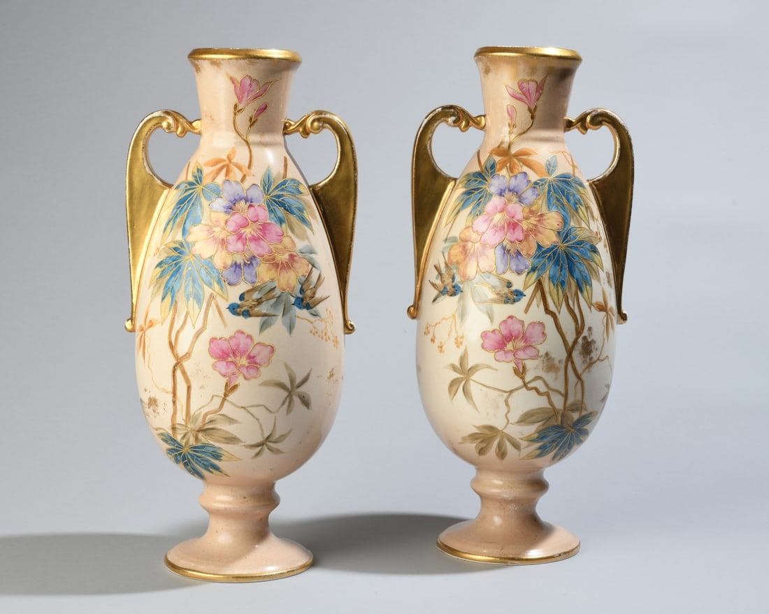 Pair of Royal Bonn Porcelain Vases: Royal Bonn, marked to underside, double handled vases with floral decoration and gilt accents. Some rubbing and gilt loss, no visible chips, cracks, or repairs. Dimensions approx. 13 1/2" x 6". Our