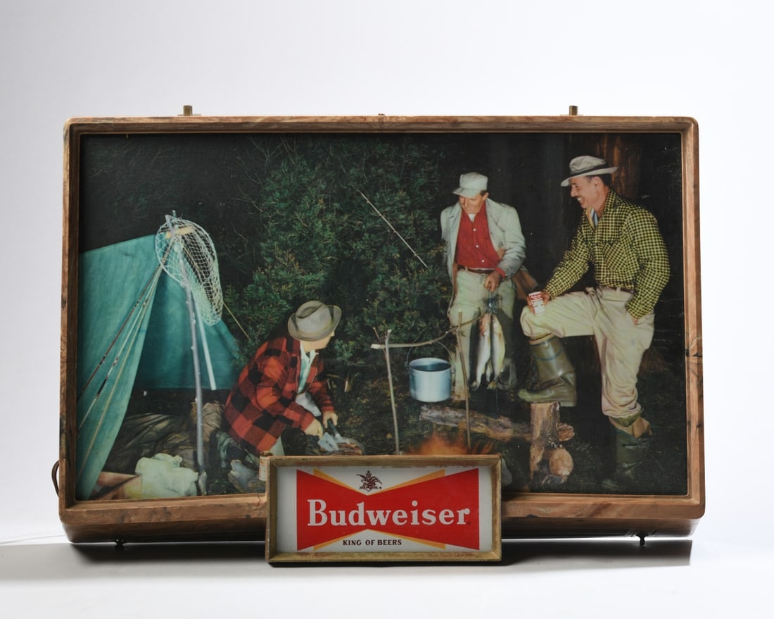 Vintage Budweiser Lighted Sign: With camping and fishing scene and faux woodgrain frame. Reverse marked Property of Anheuser-Busch. Tested working, lights when powered on. Moderate wear from age and use, some cracks to frame.