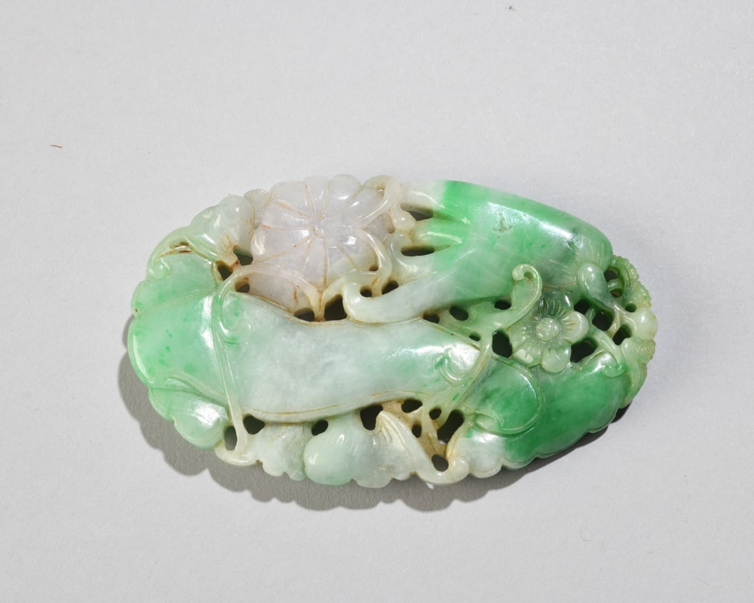Chinese Jade / Hardstone Carving: In green and white with hints of lavender, pierced design with floral motifs. Approx. 3 1/2" x 2 1/4". Our primary recommendation is to arrange shipping yourself using Blue Ridge Pack & Ship. Most bid