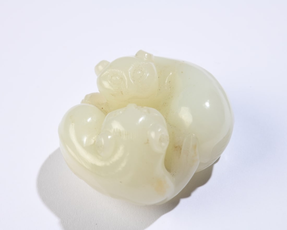 Chinese Hardstone / Jade Carving of Two Bears: Pale celadon figure depicting two recumbent bears nestled together, small chip to ear. Approx. 1 3/4" x 1 1/2" x 1". Our primary recommendation is to arrange shipping yourself using Blue Ridge Pack &