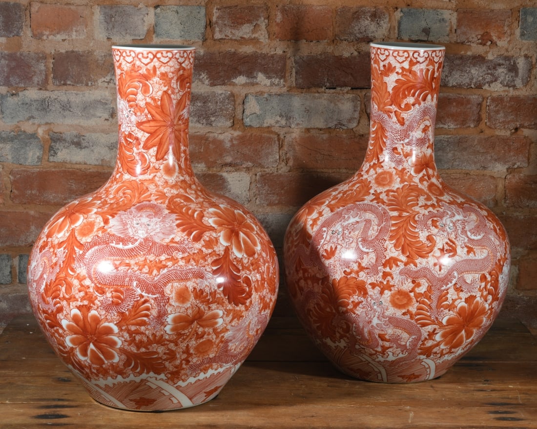 Pair of Large Japanese Kutani Red Dragon Vases: An impressive, large pair of 20th century Japanese Kutani porcelain vases. Featuring elaborate, highly detailed iron-red dragon and floral decoration. The bases bear a blue underglaze square seal mark