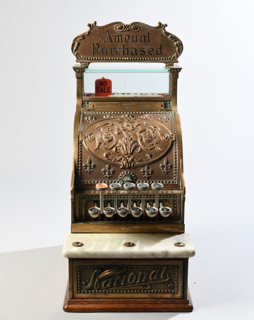Antique National Cash Register Model 216: Antique National Cash Register Co. (Dayton, Ohio) Model 216, serial number 589913. Features an ornate cast brass case in the Fleur-de-Lis pattern with an original "Amount Purchased" brass topper sign 