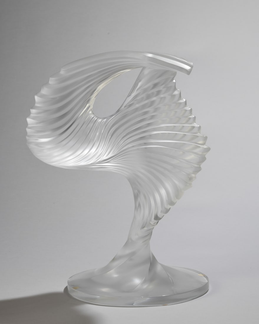 Lalique Moyen Modele Trophy Sculpture: Lalique abstract sculpture, 20th century, marked to underside. Chip to rim of base. Dimensions approx. 12 1/2" H x 9 1/2" W. Our primary recommendation is to arrange shipping yourself using Blue