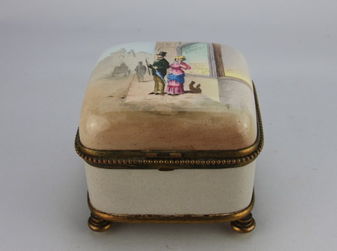 French St. Denis Porcelain and Ormolu Box: With street scene on lid, marks on base, circa mid 19th century. H: approx. 4 1/2", W: approx. 5". Our primary recommendation is to arrange shipping yourself using Blue Ridge Pack & Ship. Most