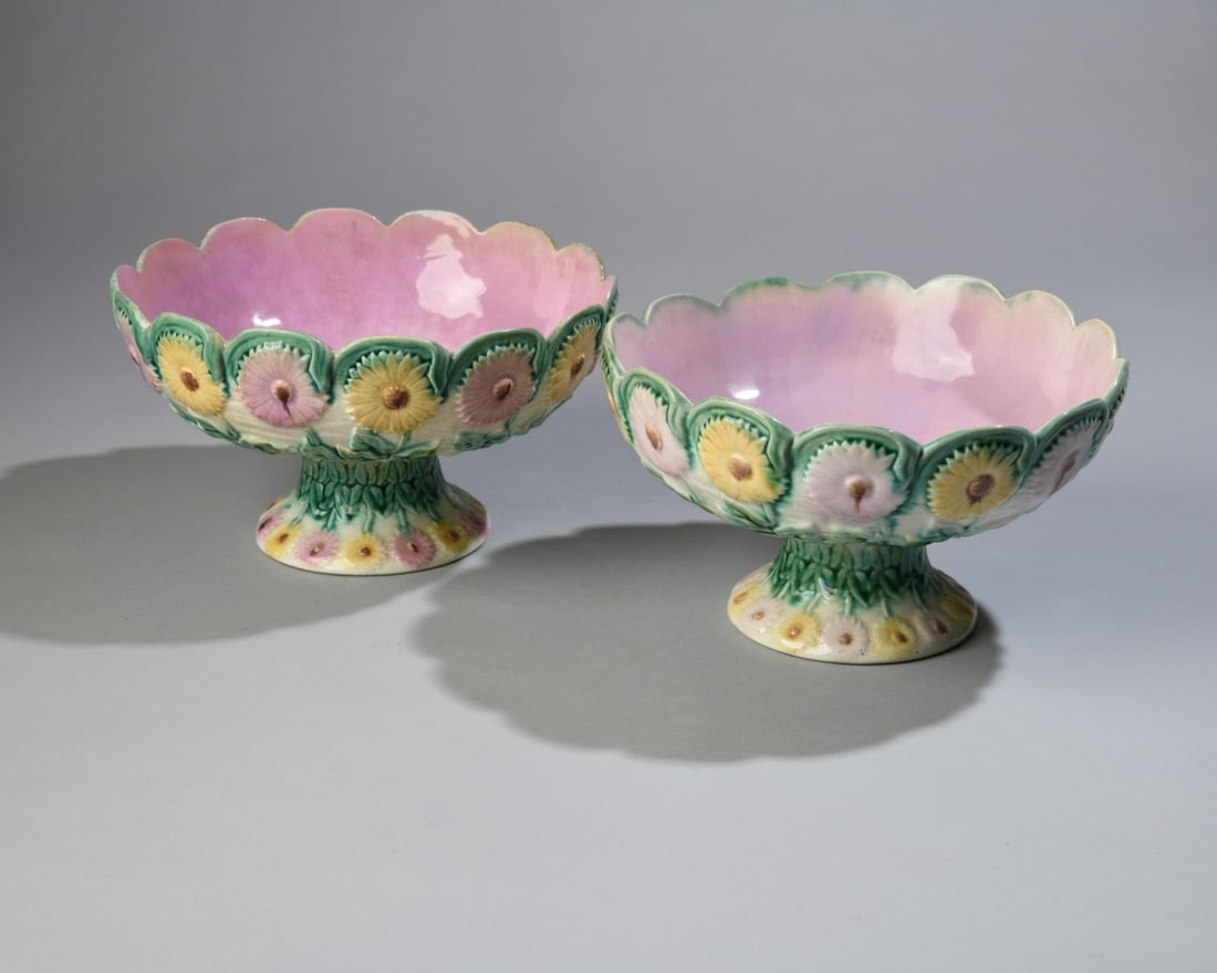 Pair of Griffen, Smith & Hill Majolica Compotes: A matched pair of late 19th century American majolica footed compotes by Griffen, Smith & Hill at the Phoenixville Pottery in Phoenixville, Pennsylvania. Each marked to underside. Glaze flake and