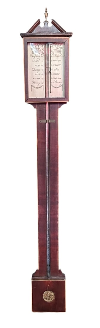 Antique English Mahogany Stick Barometer: Probably first-half 19th century, architectural broken pediment centered by a brass urn finial above a glazed engraved register with seasonal weather indications, exposed glass mercury tube, boxwood l