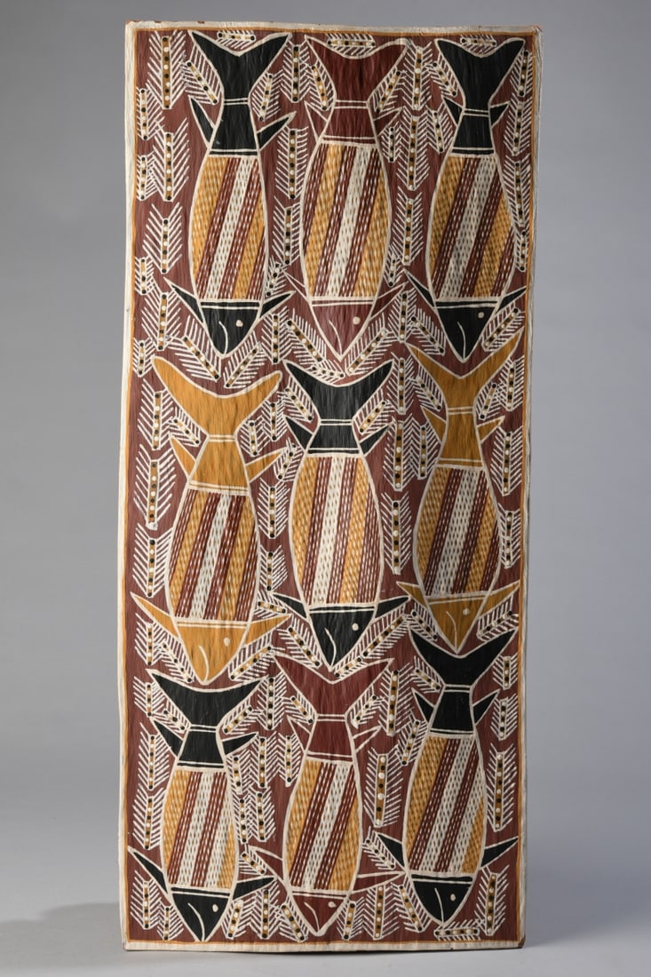 Dick Durrurrnga Yambal (Australian, 1936 - 2016): Natural ochre pigments on eucalyptus bark, with label dated April 2, 1979, depicting rows of stylized bream fish surrounded by cross-hatched motifs. Dick Durrurrnga Yambal (1936 - 2016) was a prominen