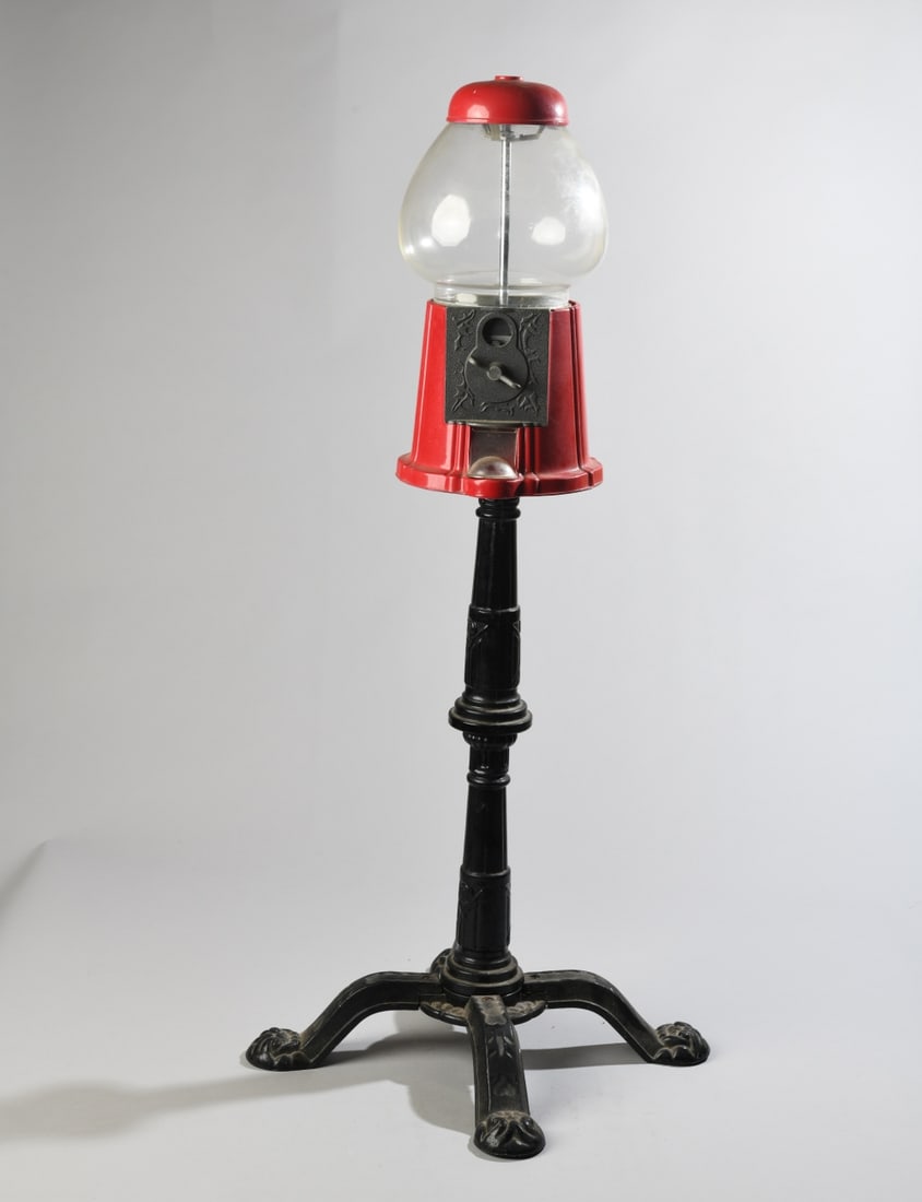Vintage Style Gumball Machine, Late 20th C.: Features glass globe and cast metal stand and base. In working condition. Dimensions: approx. 37 1/2" H x 18" x 18". Our primary recommendation is to arrange shipping yourself using Blue Ridge Pack &