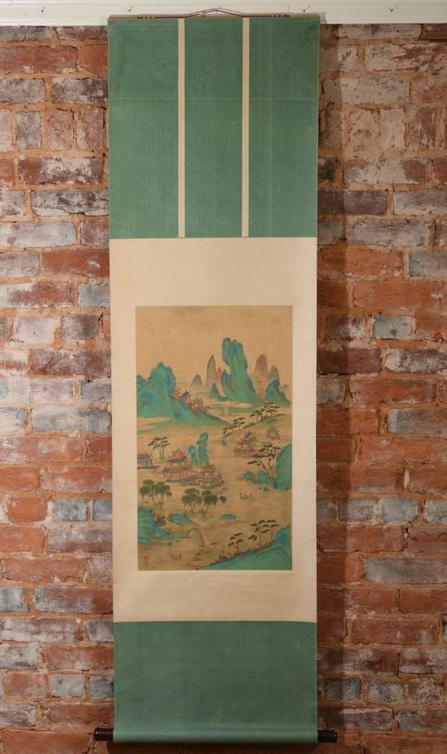 Chinese Landscape Hanging Scroll: Showing an architectural mountain landscape with figures, temples, and boats in a stylized palette, red seal mark lower left. Scattered staining / discoloration visible throughout image and mount,