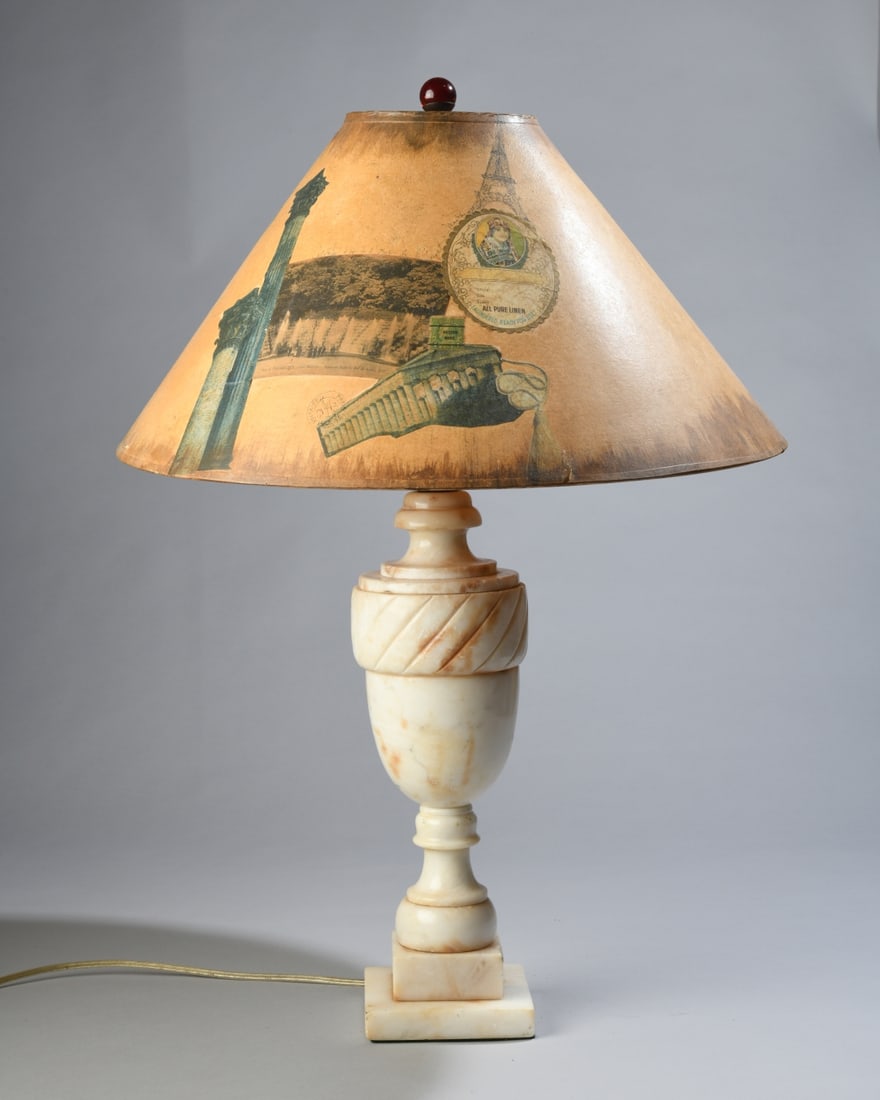 Alabaster Table Lamp with Decoupage Shade: 20th century carved alabaster lamp with urn form on square plinth base. Decoupage shade featuring European travel ephemera with handwritten initials and dated 1997. Lamp with some surface wear,