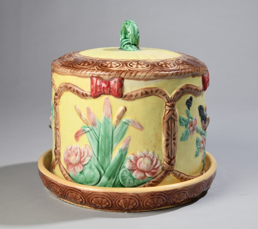 Majolica Cheese Dome and Dish: Likely late 19th century, with floral and bird decoration80. Allover crazing. Dimensions: approx. 9 1/2" H x 10" dia. Our primary recommendation is to arrange shipping yourself using Blue Ridge Pack