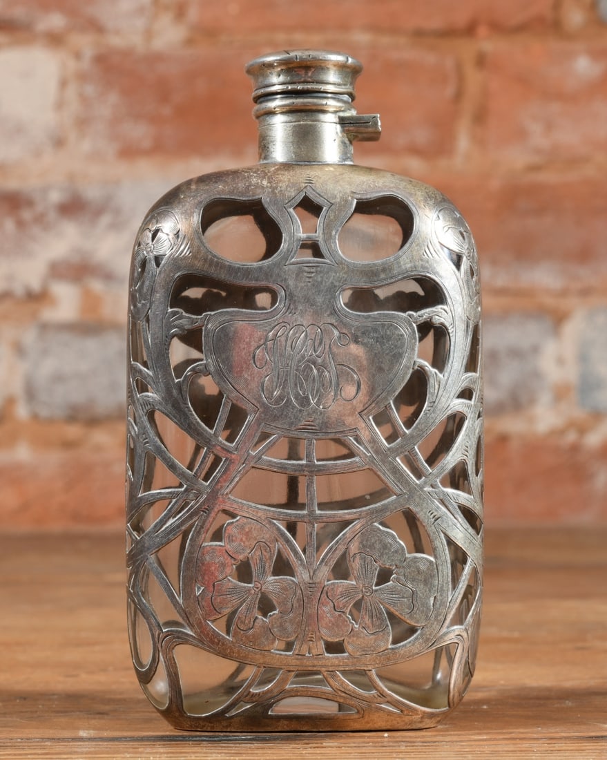 Art Nouveau Silver Overlay Flask: An Art Nouveau fine silver overlay glass flask, c. 1900, retailed by Black, Starr & Frost and stamped FINE 999/1000 SILVER. Features pierced floral overlay and a monogrammed cartouche (HCS) with a