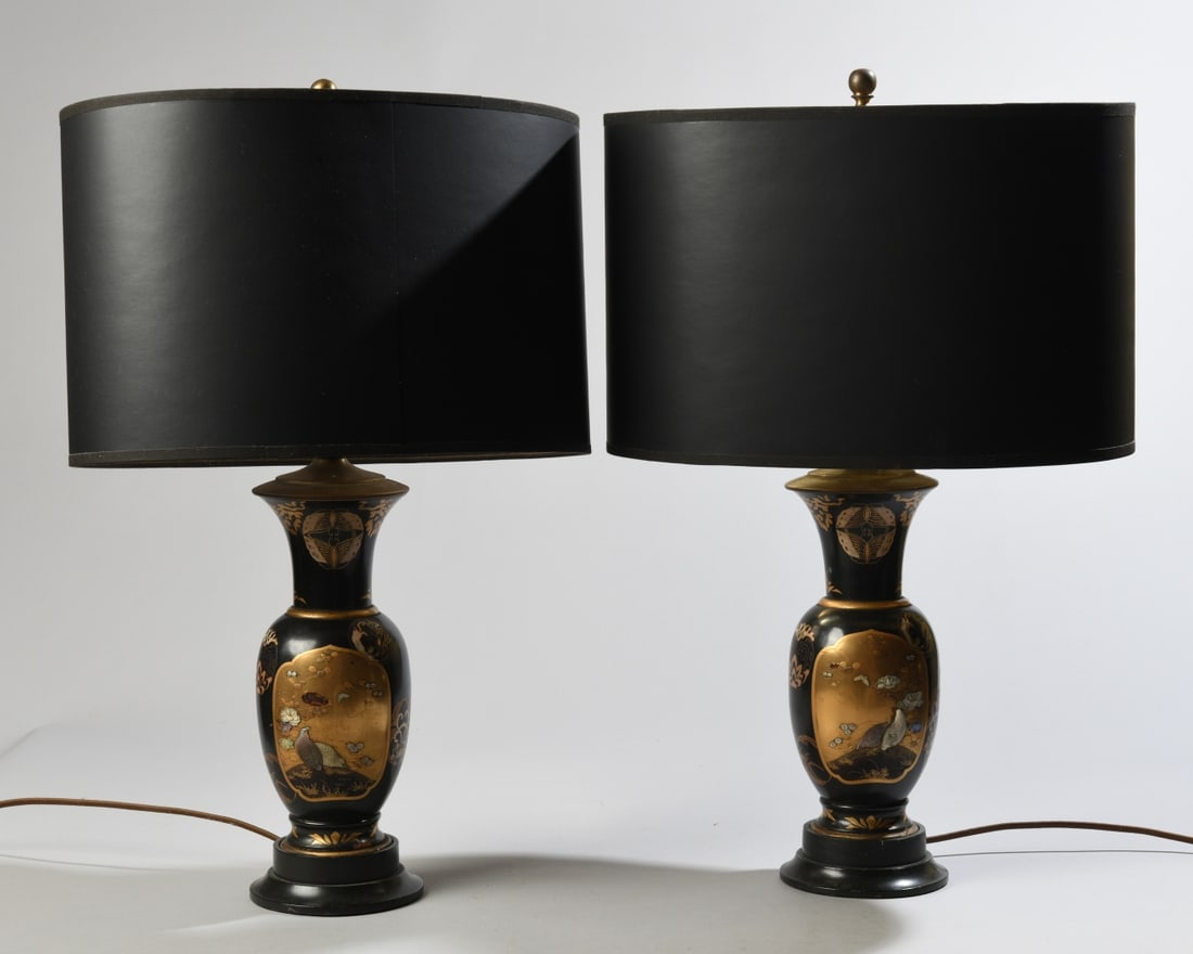 Pair of Japanese Lacquer Table Lamps: Urn-shaped vases converted to lamps, featuring black lacquer with gilt details and raised mixed-material designs in the Shibayama style. Some losses to applied decoration; both lamps in working condit