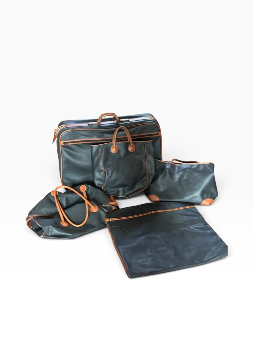 Bottega Veneta Vintage 5-Piece Luggage Set: A vintage five-piece luggage suite by Bottega Veneta, including a large a suitcase, a folding garment bag, a duffel bag, and two tote bags. Suitcase dimensions approx. 27" x 21" x 7 1/2". Our primary 