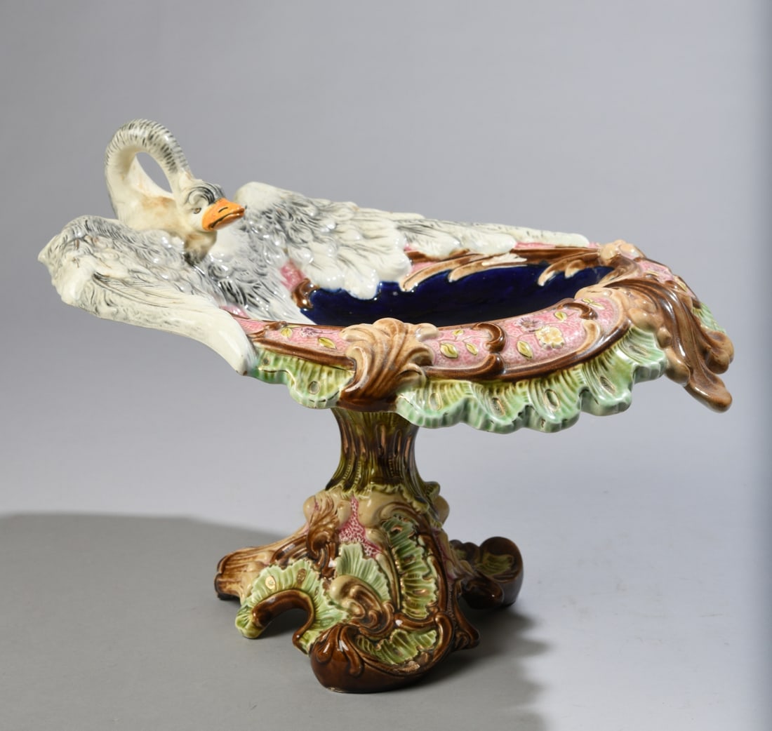 Eichwald Majolica Centerpiece with Figural Swan: Early 20th century, impressed "Eichwald 4166" to underside, two-part construction connected by central bolt. Some surface scratches to basin and minor glaze wear. Dimensions: approx. 10 1/2" H x 15"
