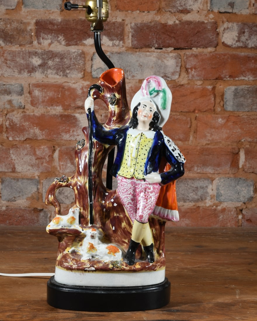Staffordshire Spill Vase Lamp: English Staffordshire pottery spill vase depicting a shepherd with sheep, converted into a table lamp. Dimensions approx. 25 1/4" x 8" x 5". Our primary recommendation is to arrange shipping yourself