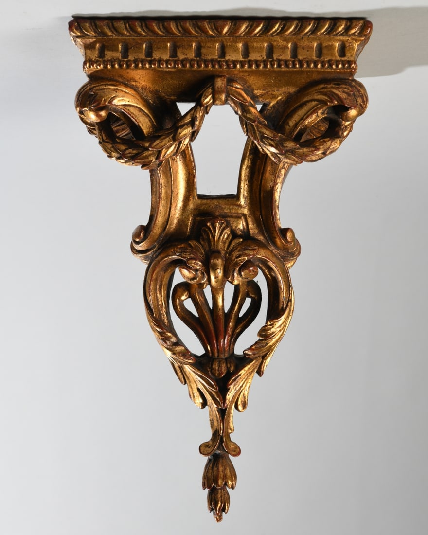 Vintage Rococo Revival Wall Bracket: Rococo Revival gilded wall bracket shelf crafted from heavy molded chalkware/plaster composition. Dimensions approx. 15 1/4" x 8 1/2" x 7 1/4". Our primary recommendation is to arrange shipping yourse