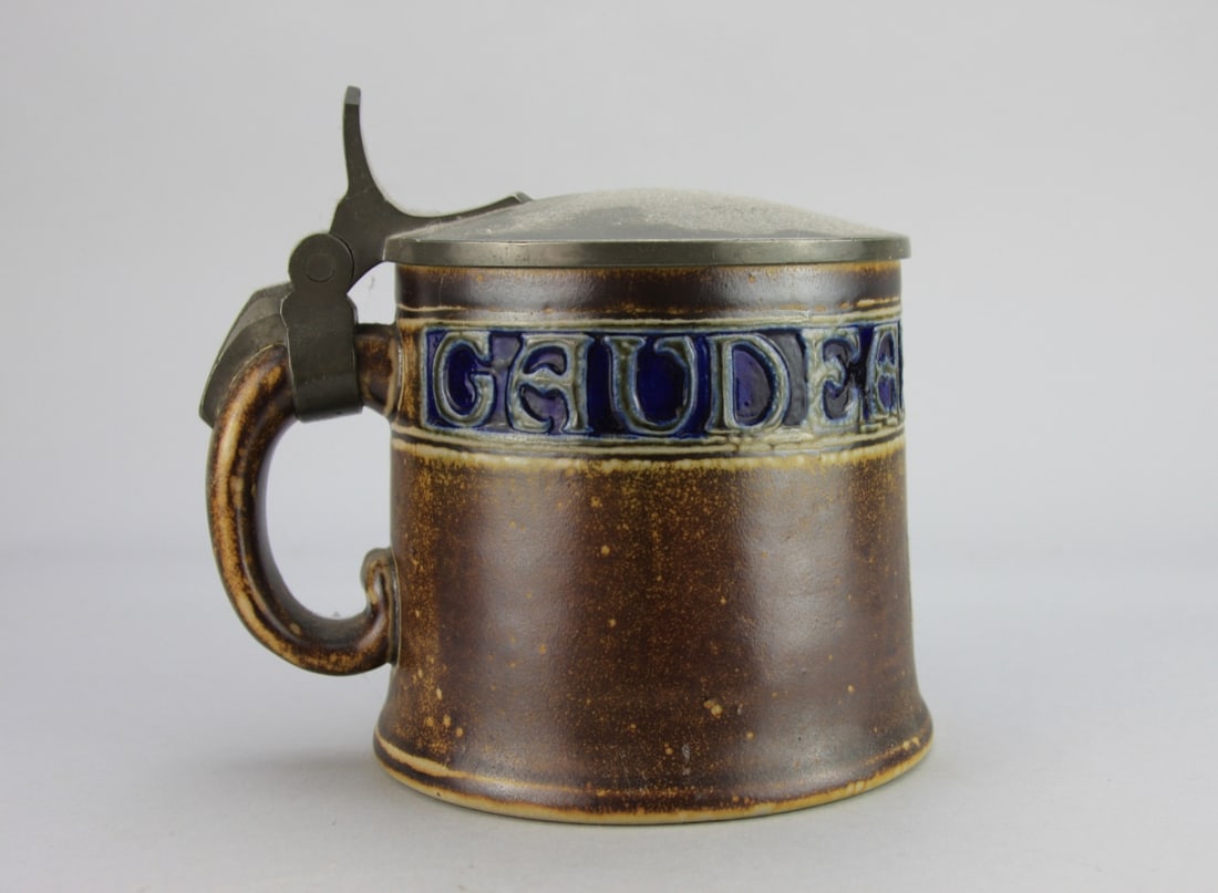 Antique German Stoneware Beerstein: Dedicated and dated 1915 on the lid, factory marks on base. H: approx. 5 1/2". Our primary recommendation is to arrange shipping yourself using Blue Ridge Pack & Ship. Most bidders find this is the mo