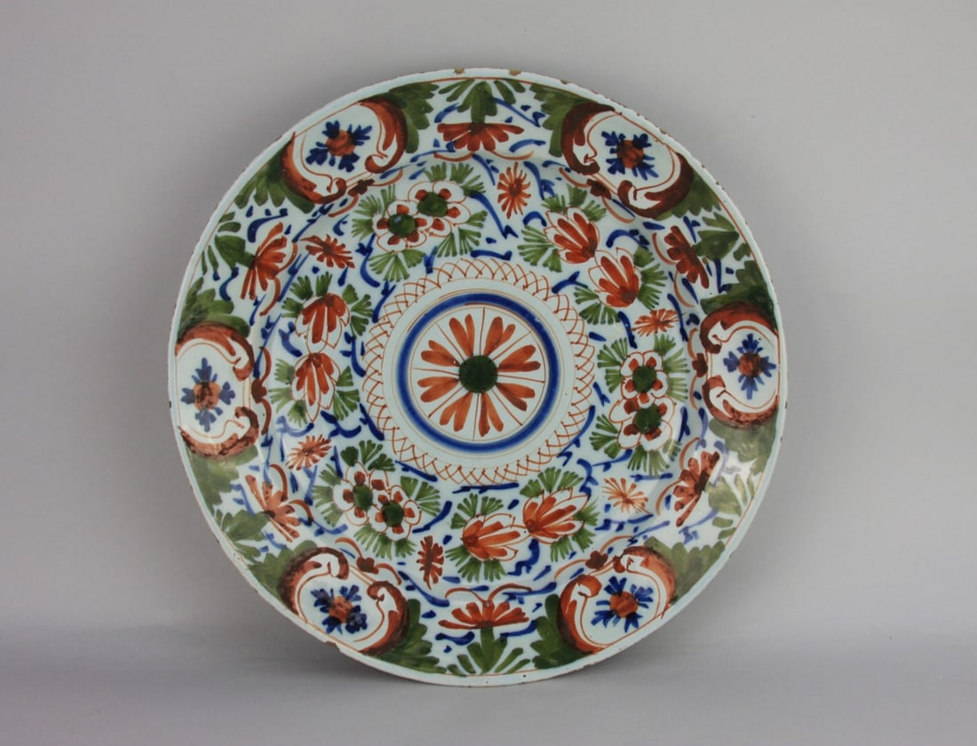 Early French Faience Charger: Decorated in Imari pallette, circa 1800, minor firing frits on the rim as seen in the photographs. Dia: approx. 13 1/2". Our primary recommendation is to arrange shipping yourself using Blue Ridge