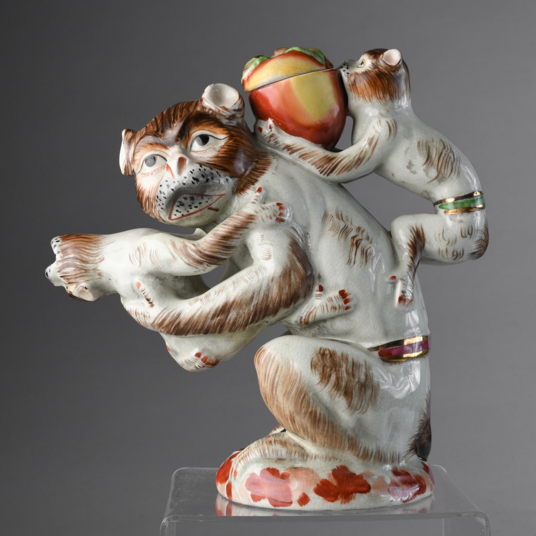 Repro of 18th C. Monkey Teapot: 20th-21st C. copy of a whimsical teapot in a design produced by Meissen and Staffordshire, among others, showing a mother monkey holding one wailing baby monkey in her arms-his open mouth forming the 