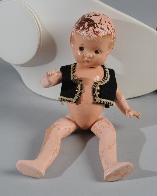 Vintage Effanbee Patsyette Doll: All composition Patsy Ann "Patsyette" Heidi Doll circa 1930s by Effanbee, wearing original Heidi costume vest. Arms legs and hair chippy but face and torso very nice. Approx. 9" tall.