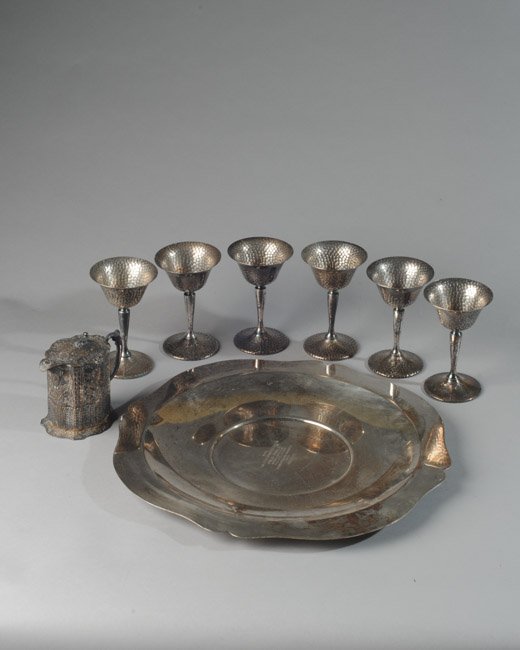 Lot of Silverplate: To include trophy platter (Dia: approx. 15"), Dutch scene relief creamer, six hammered stems (similar to Bernard rice and Sons).