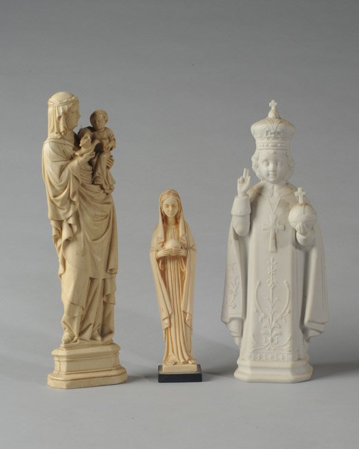 Three Religious Figurines: One is Parian and two composition, one of which is from the Metropolitan Museum of Art. Tallest: approx. 10 3/4".