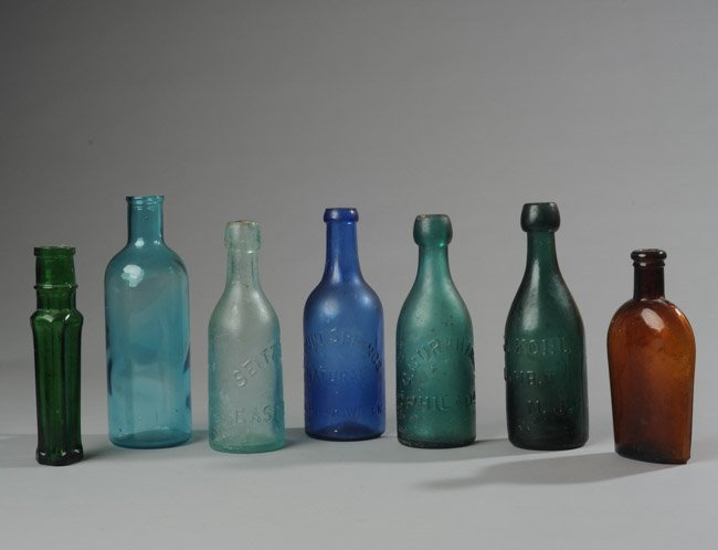 Lot of Seven Colored Glass Bottles (1 of 3)