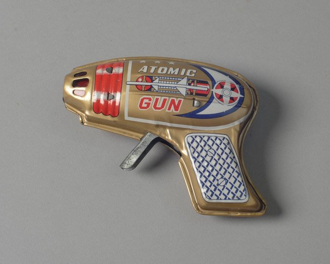 Tin Friction Atomic Gun Japan: Circa 1950s, marked "made in Japan", excellent condition. L: approx. 4 3/4".