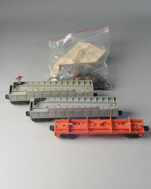 2x Postwar Lionel 356 225 Barrel Cars + 16636: Two 1954 Lionel A. T. & S. F. Barrel Cars, 356225, one with figure, and one 1991 Lionel 16636 Rio Grande log dump car. Comes with Barrels, Original printed operating instructions, control switches, in