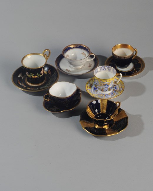 Six Demitasse Cups and Saucers: One Russian, one Rosenthal, one mismatched Hutschenreuther, one with crown and shield mark, one Bavarian, and one French.