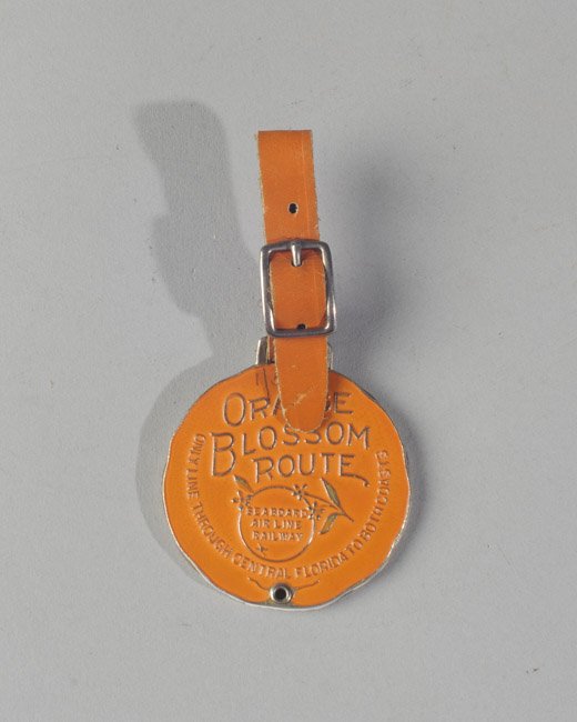 Seaboard Air line Railway Luggage Tag: "Orange Blossom Route, Seaboard Air Line Railway, Only Line Through Central Florida To Both Coasts". Dia: approx. 1 3/4".