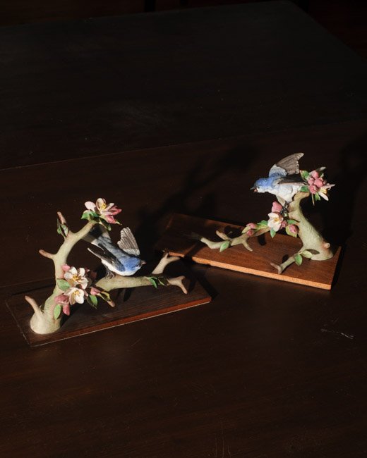 Pair Cybis Porcelain Birds: On branches with flowers. Each marked "Cybis #34", mounted , minor damage. H: approx. 6 3/4".