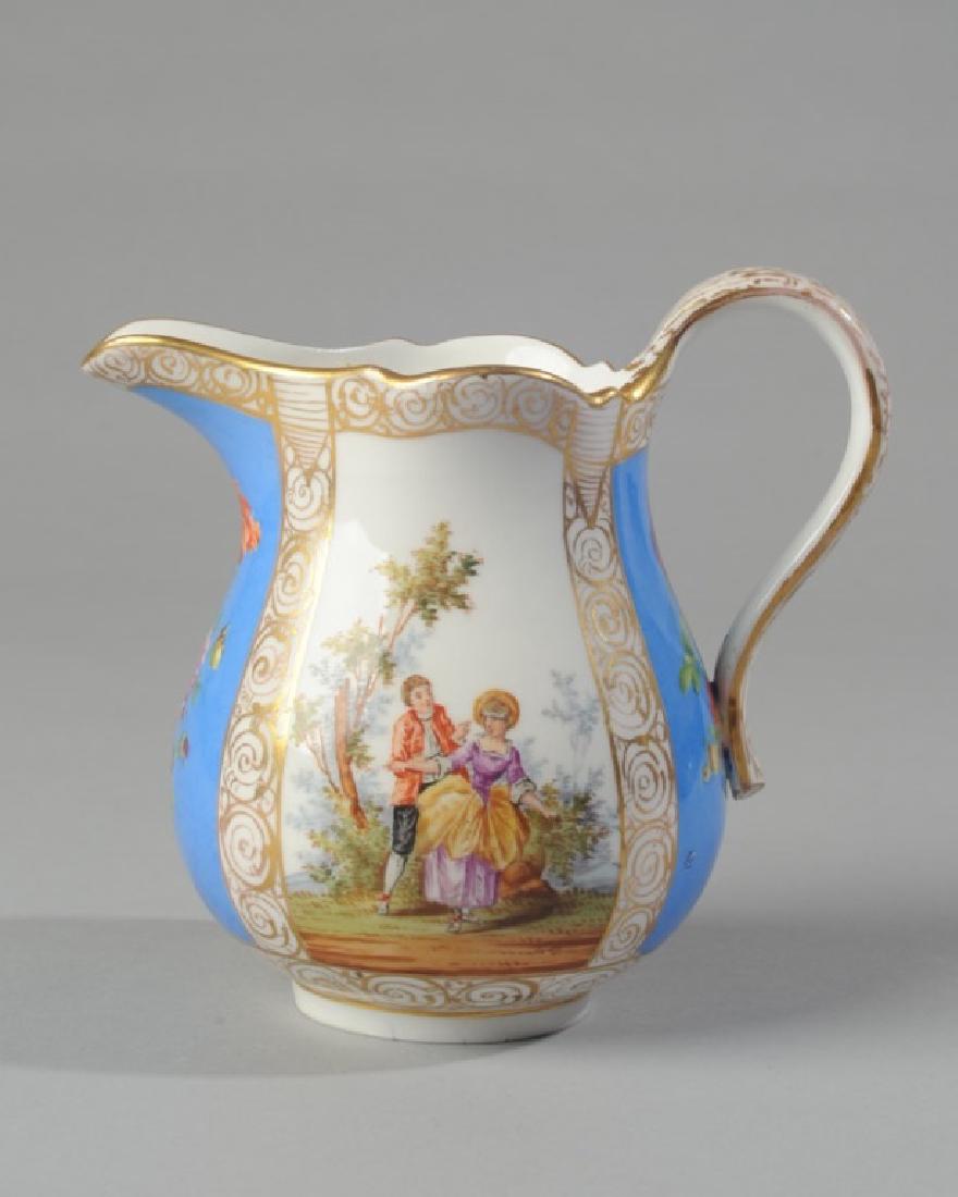 Meissen Pitcher: Alternating panels of courting couples and flowers, crossed swords mark to base and Germany. H: approx. 5 1/4". A1481