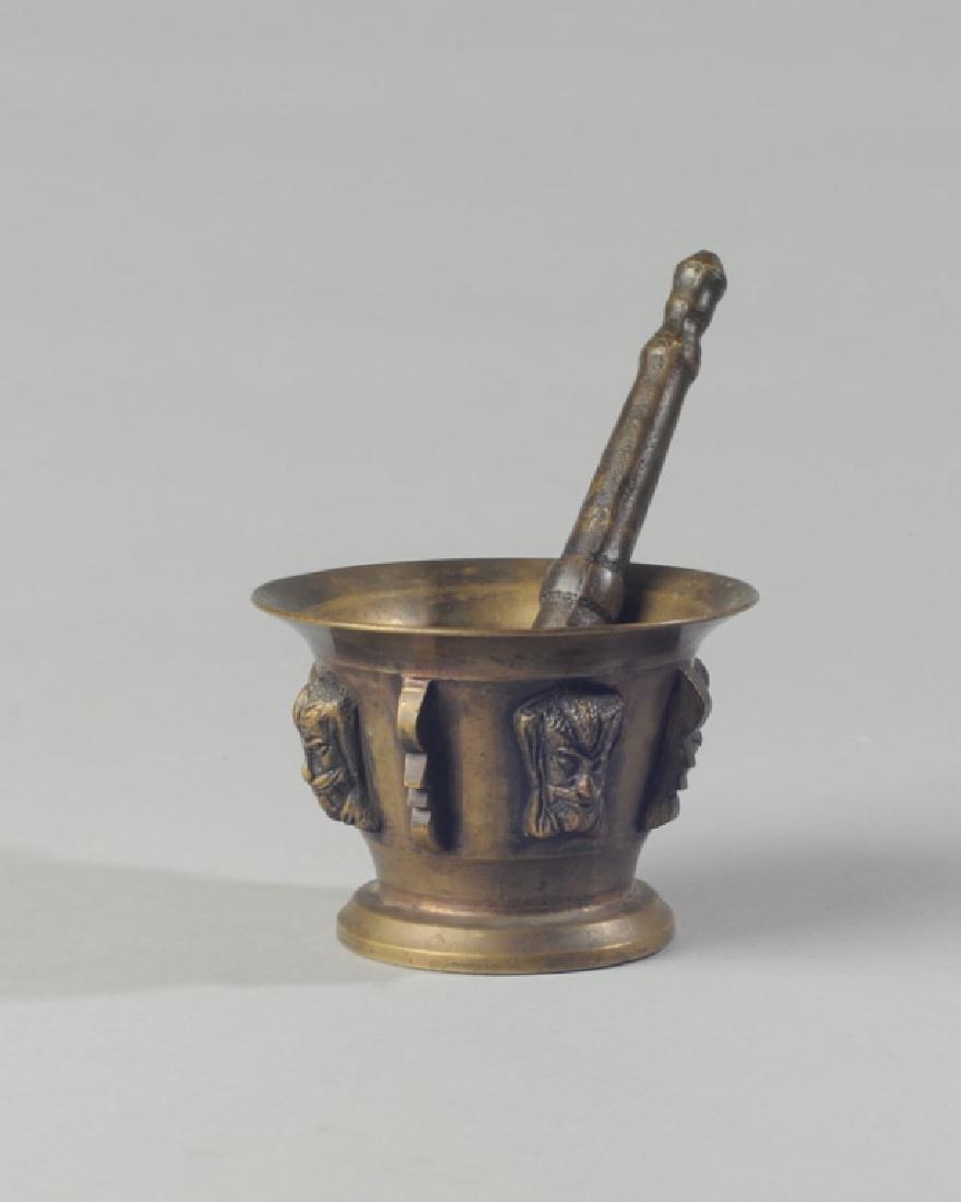 Brass Mortar and Pestle: Mortar with relief masks around border. Morter H: approx. 3".