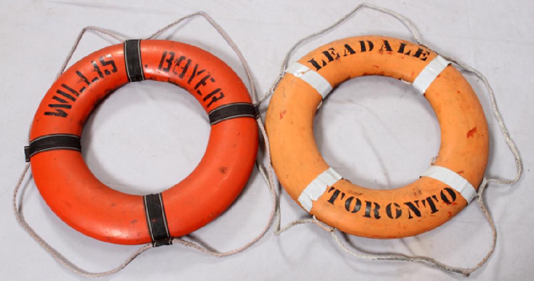 WILLIS BOYER & LEADALE TORONTO LIFE RINGS 2: WILLIS BOYER & LEADALE TORONTO LIFE RINGS, 2, DIA 29":Two life rings one orange and stenciled in black: "Willis Bayer". Second ring, orange in color and stenciled: "Leadale Toronto". Both having grab 