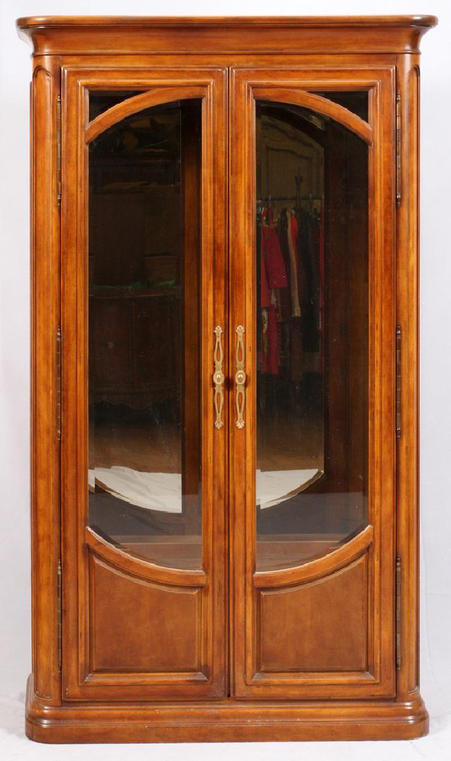 HENREDON ART NOUVEAU STYLE MAHOGANY DISPLAY CABINET: HENREDON ART NOUVEAU STYLE MAHOGANY DISPLAY CABINET, H 84", W 48":Flared top and bottom corner pedestals with a mirrored back and beveled glass front doors. Measures approximately H.84" x 48" x 18". E