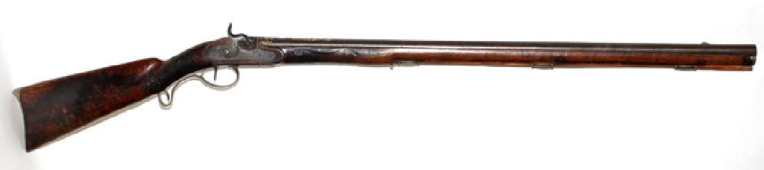 ARABIC GOLD INLAY PERCUSSION CAP RIFLE C1850 BARREL: ARABIC, GOLD INLAY PERCUSSION CAP RIFLE, C1850, L 33" BARREL:Gold damascene inlaid inscriptions in Arabic text, on top of 33" round barrel. Full walnut stock with cheek plate and carved dragon, checke