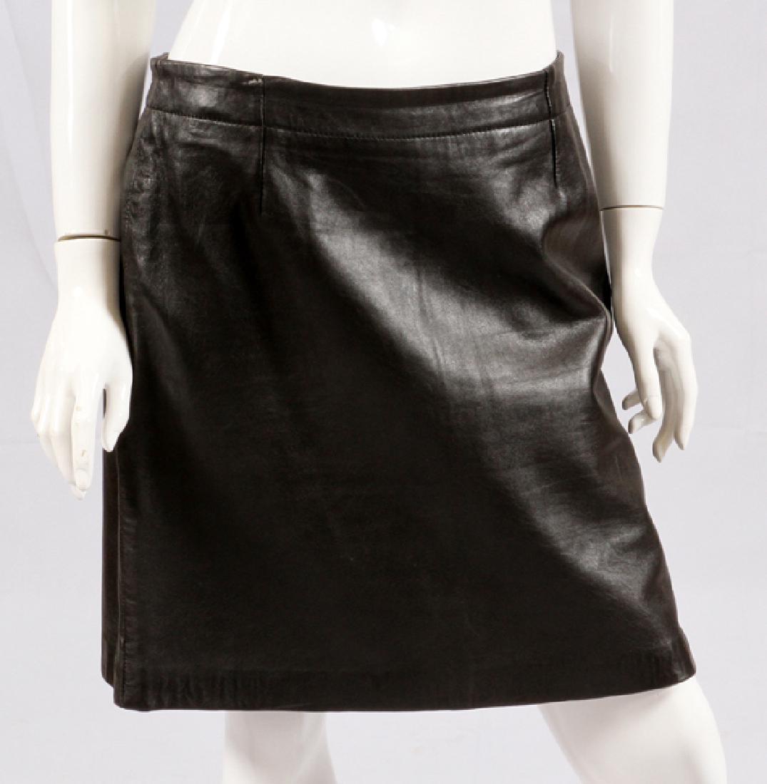 DKNY BLACK LEATHER SKIRT: DKNY BLACK LEATHER SKIRT, SIZE 10:Black leather banded skirt with zipper. Labeled: Donna Karan New York.