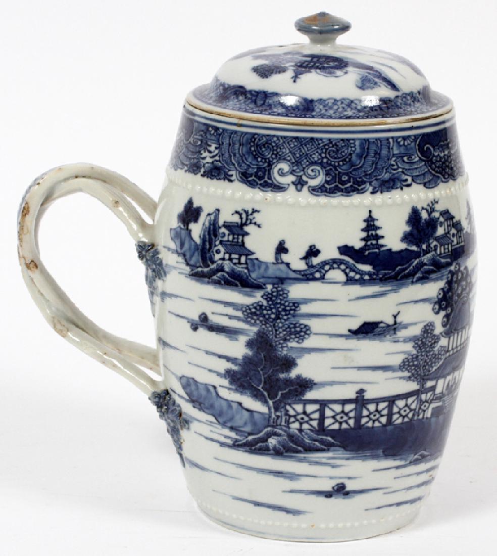 CHINESE 18TH.C. BLUE & WHITE PORCELAIN: CHINESE 18TH.C. BLUE & WHITE PORCELAIN COVERED TANKARD, H 7 1/2", L 6 1/2":Double intertwined strap handle. Underglaze blue on white Nanking pattern. Raised bead borders. From the Estate of Daniel Cla